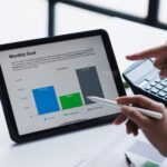 Business professionals reviewing financial data and evaluating options, representing the process of selecting the right tradeline for financial planning.